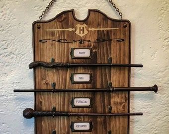 A wooden rack with four different kinds of wands.