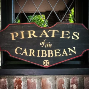A sign that says pirates of the caribbean.