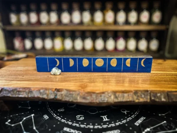 A wooden table with a blue box on top of it