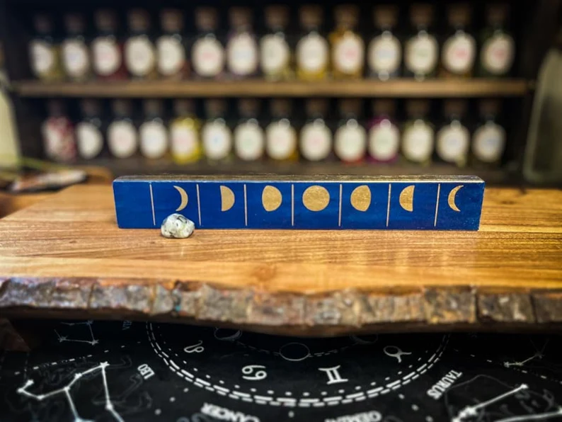 A wooden table with a blue box on top of it