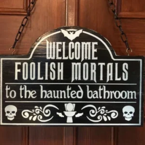 A sign hanging on the door of a house.