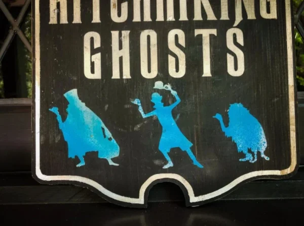 Hitchhiking Ghosts sign with figures.