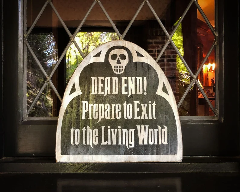 A sign that says dead end, prepare to exit to the living world.