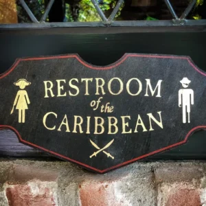 Restroom sign with Caribbean theme.