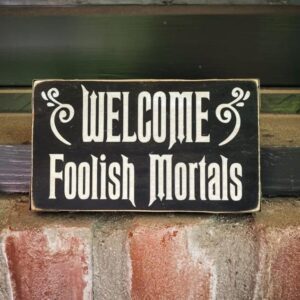A sign that says welcome foolish mortals