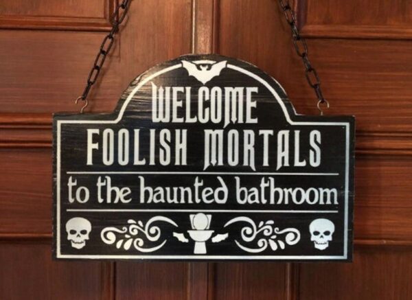 Haunted bathroom welcome sign.