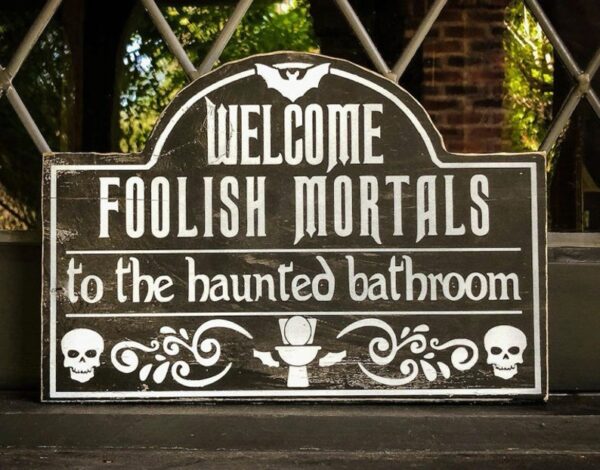 Haunted bathroom welcome sign.