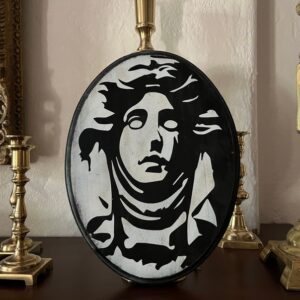 Black and white oval portrait painting.