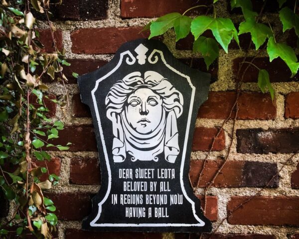 Here's an alt tag for the image: Leota's tombstone, Haunted Mansion.