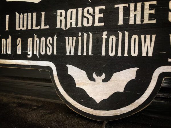 Halloween sign: bat, ghost, spooky.