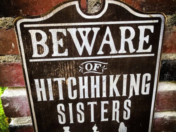 Beware of hitchhiking sisters sign.