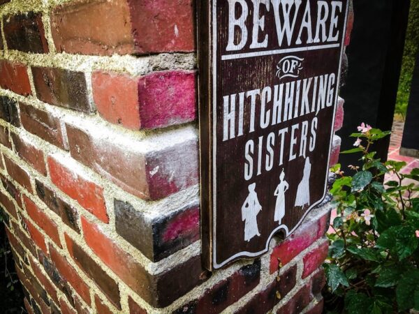 Beware of hitchhiking sisters sign.