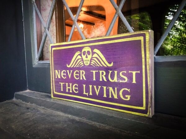 Purple sign: Never trust the living.