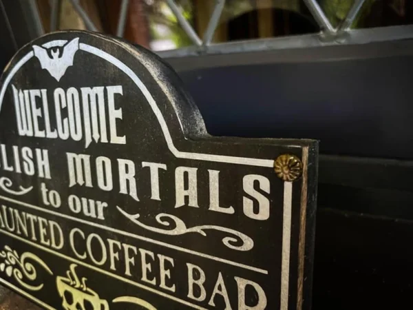 Haunted coffee bar welcome sign.