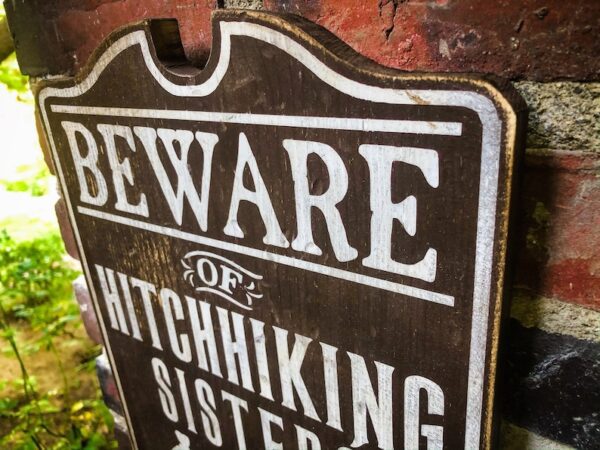 Beware of hitchhiking sisters sign.