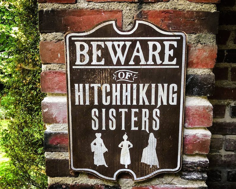 Beware of hitchhiking sisters sign.