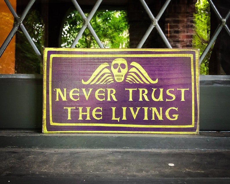 Purple sign: Never trust the living.