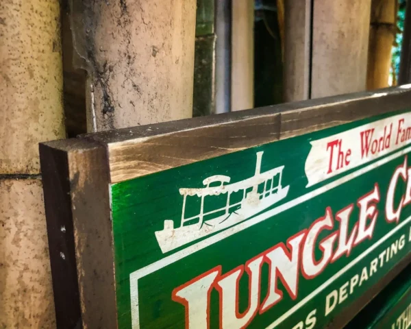 Jungle Cruise sign, boat departing.