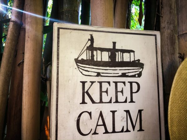 Keep calm boat sign bamboo background.