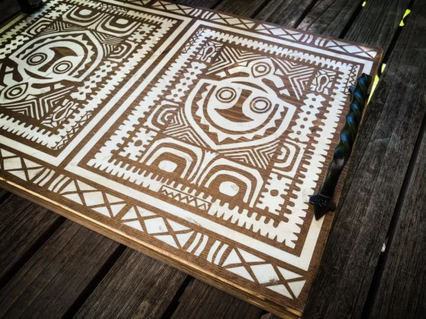 Wooden tray with Polynesian tribal design.