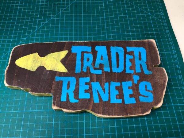 Trader Renee's wooden sign with fish.