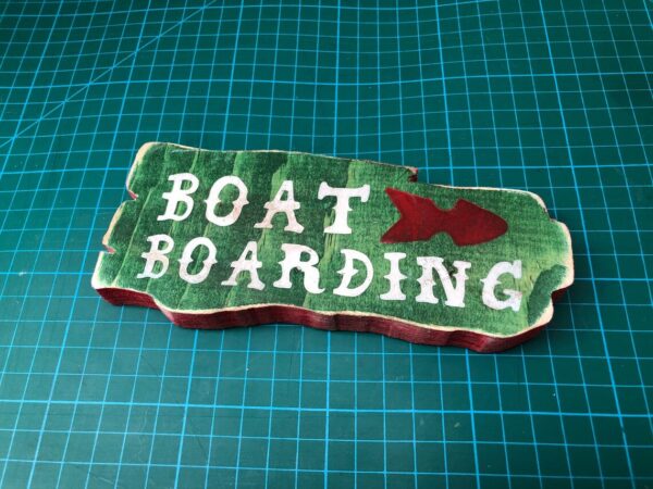 Here's an alt tag for the image: Boat boarding sign with fish.