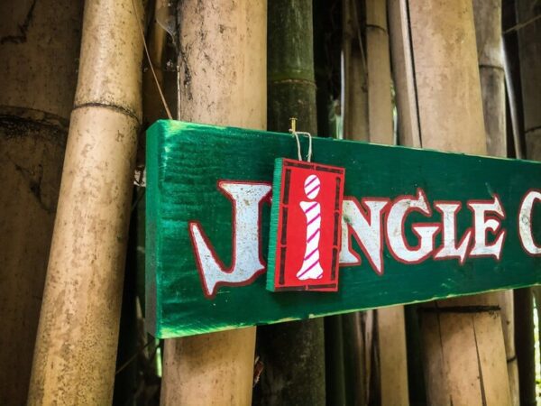 Jingle Cats green sign on bamboo.