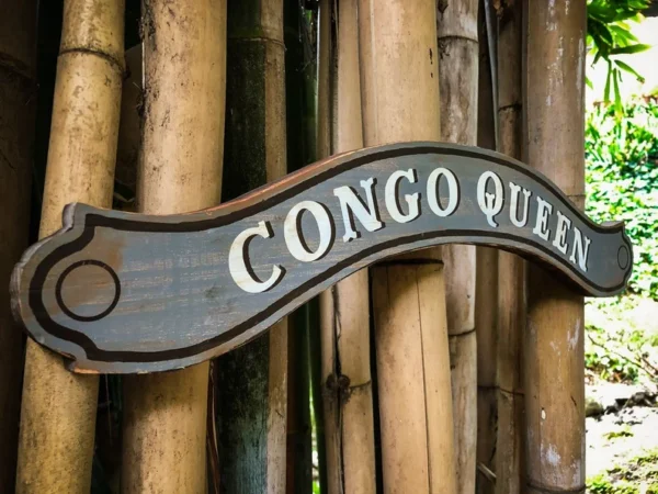 Congo Queen sign on bamboo fence.