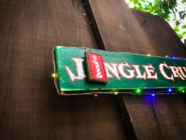 Jingle Cruise sign with lights.