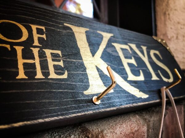 Here's an alt tag for the image: "Of the Keys key holder"