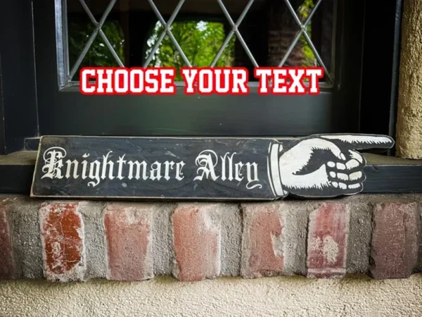 Nightmare Alley signpost with pointing hand.