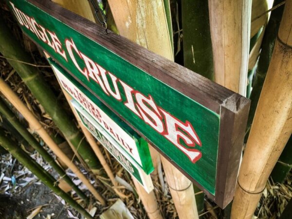 Jungle Cruise sign, hanging outdoors.