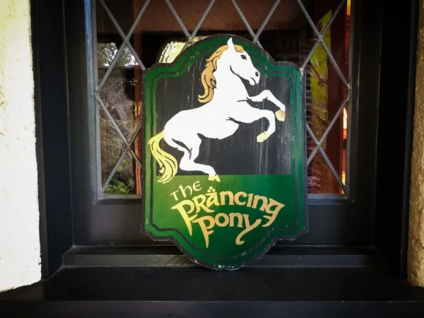 The Prancing Pony pub sign.