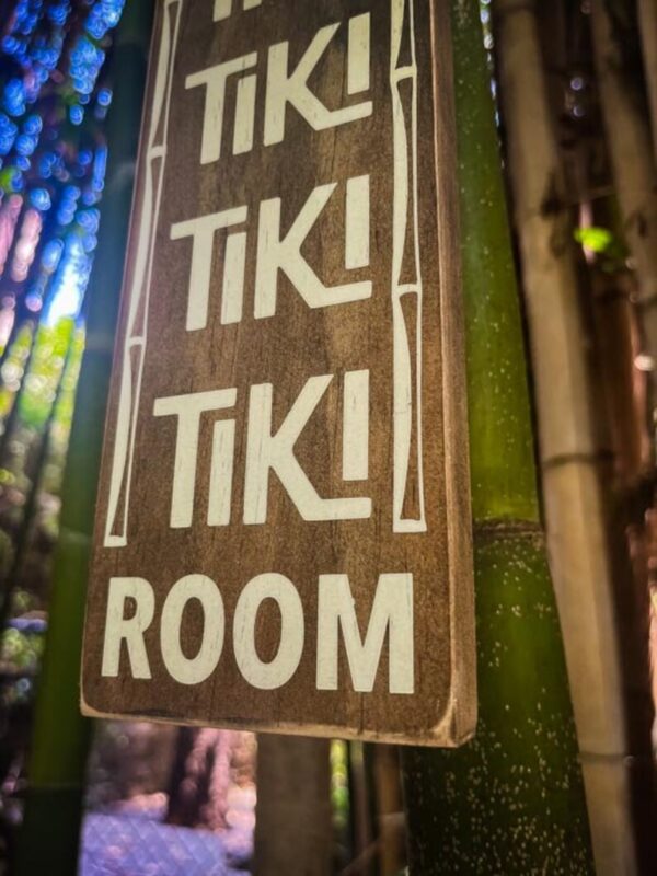 Tiki Room sign on bamboo.