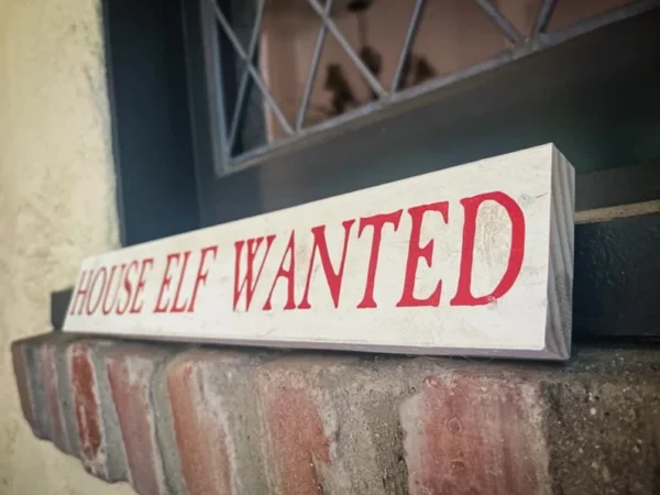 House elf wanted sign.