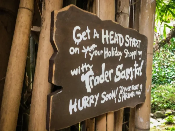 Here's an alt tag for the image: Trader Sam's Holiday Shopping Sign