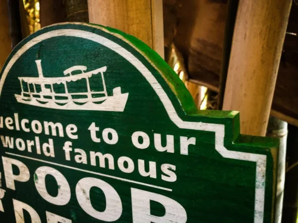 Green sign: Welcome to our world-famous poop deck.