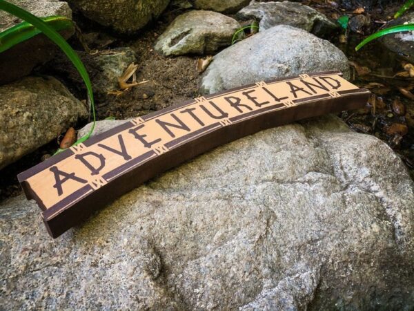 Adventureland sign on rocks