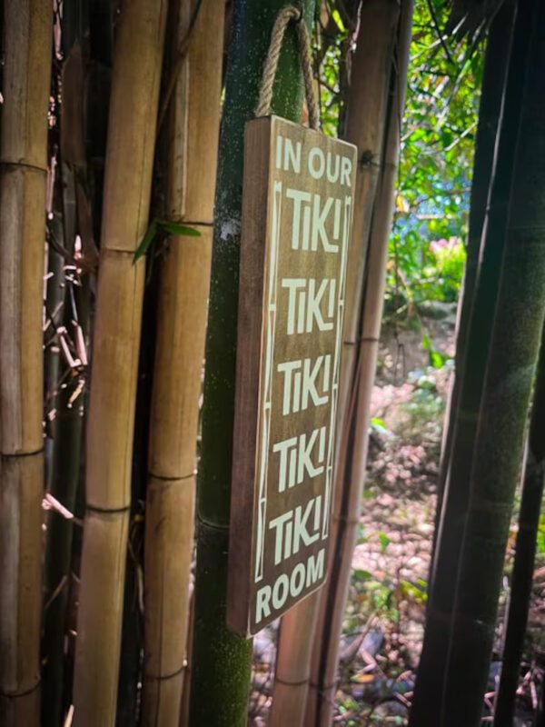 Wooden sign: In our Tiki Room.