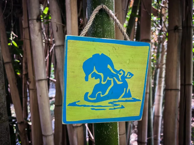 Blue hippopotamus sign on bamboo.