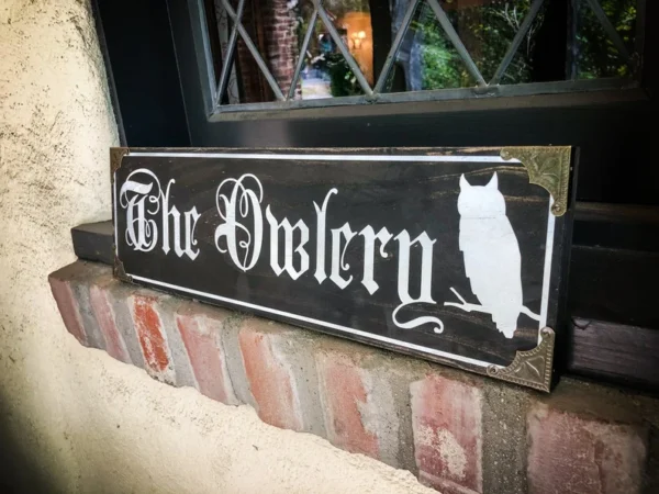 The Owlery sign with owl image.