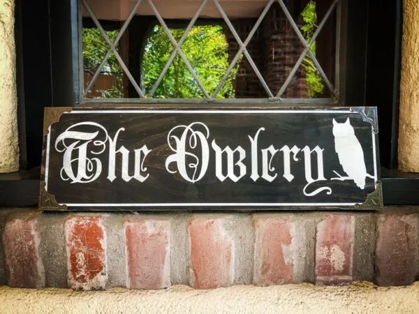 The Owlery sign with owl silhouette.