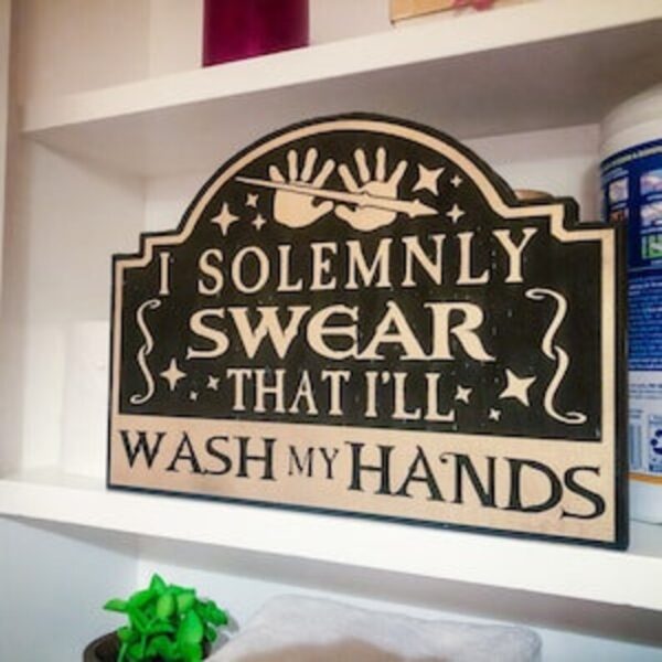 Here's an 8-word alt tag for the image: "I solemnly swear I'll wash my hands sign"