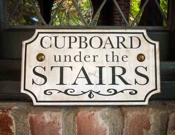 Cupboard under the stairs sign.