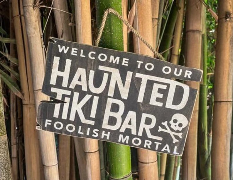 Haunted Tiki Bar sign welcomes you.