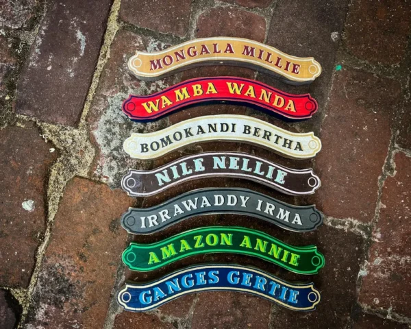 Riverboat names on decorative plaques.