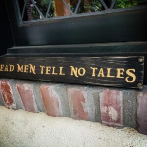 "Sign reading 'Dead men tell no tales'"