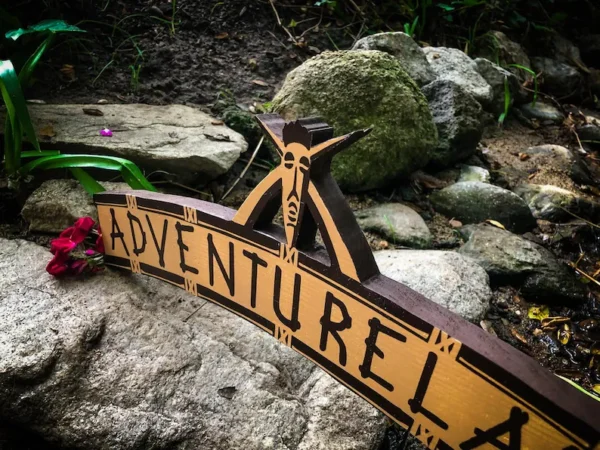 Adventureland sign, carved wood.