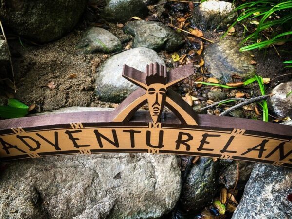 Adventureland sign, carved wood.